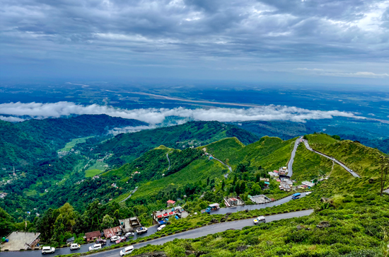 Panoramic view of the Siliguri plains from Rohini Road, a scenic drive on a Peer Baba car rental trip to Darjeeling via Kurseong.