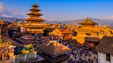 The historic Bhaktapur Durbar Square bustling with activity, a key cultural highlight in a Peer Baba Nepal tour package.